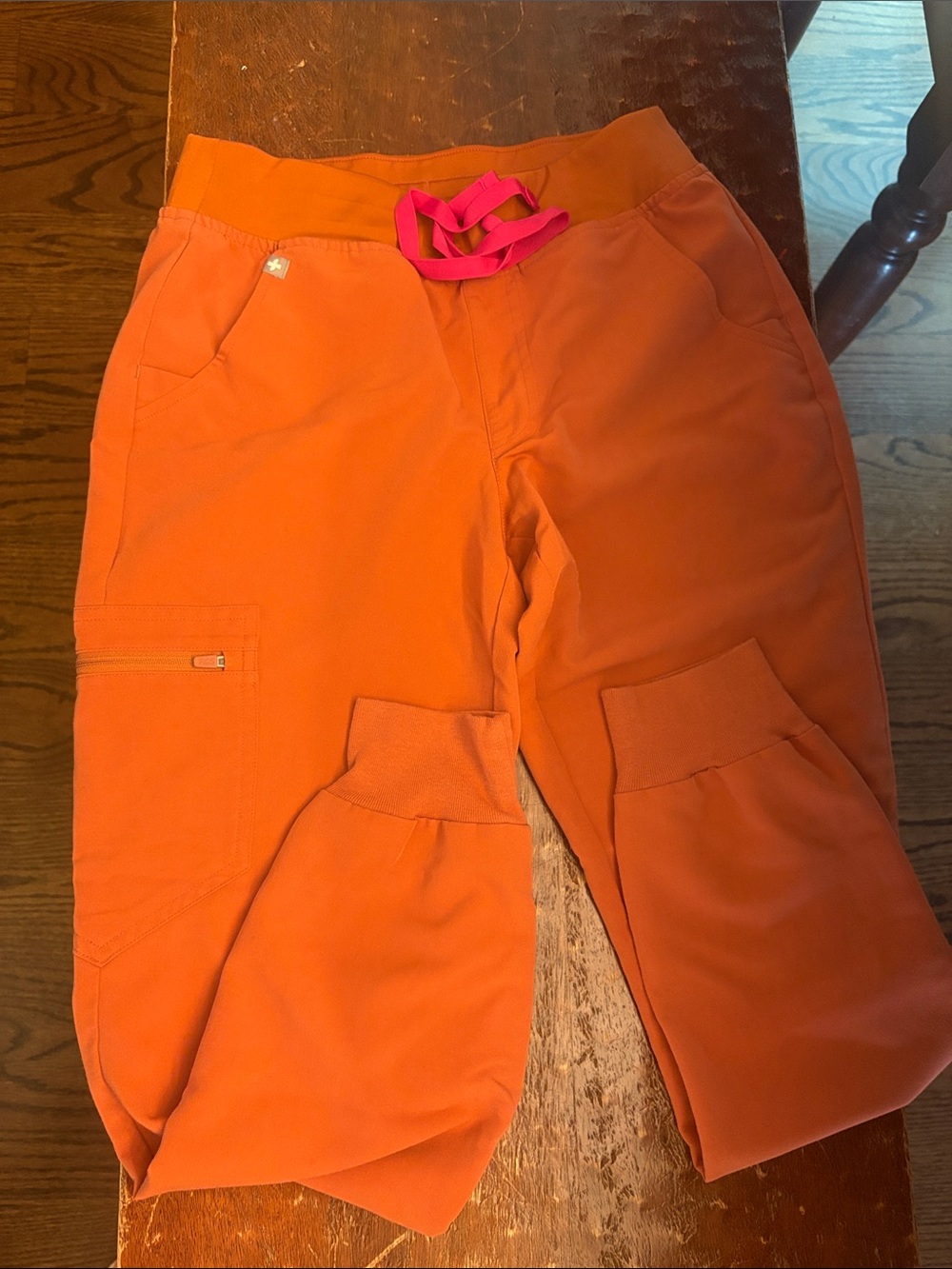 Figs Women's Ankle Cargo Scrub Pants in Orange with Pink Drawstring